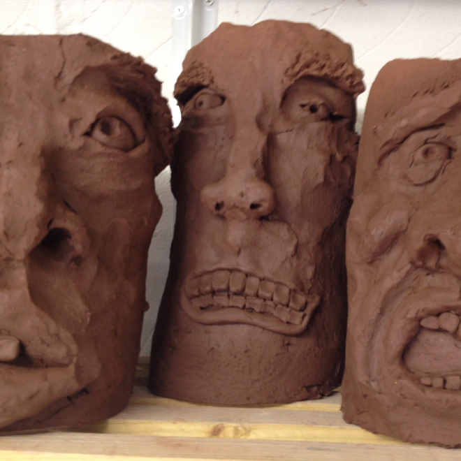 Clay sculpted faces